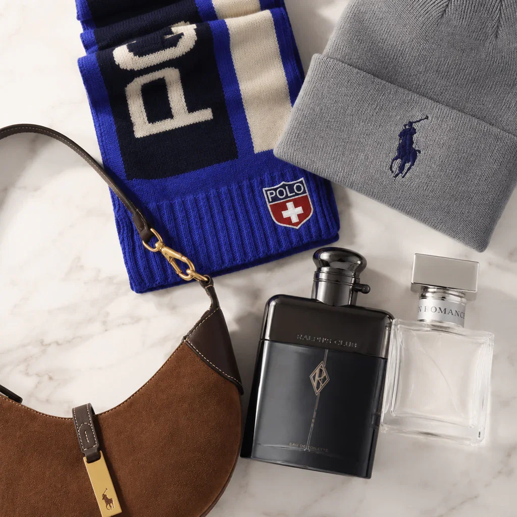 Ralph Lauren Timeless Style collection featuring blue polo scarf, gray sweater, brown suede bag, and black fragrance bottles.