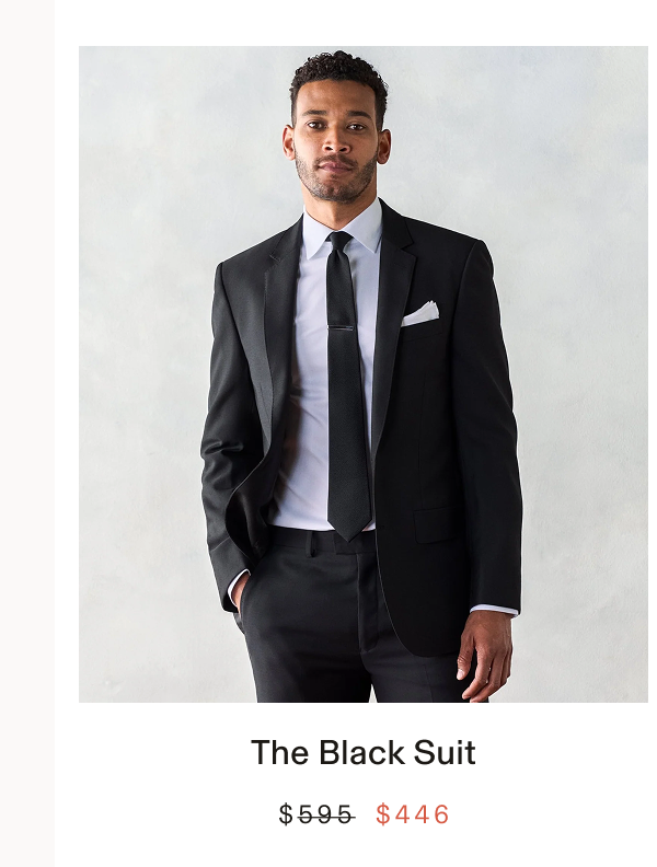 Man wearing a black suit with a white shirt, black tie, and white pocket square, one hand in his pocket. Text below the photo: "The Black Suit BUY $446"