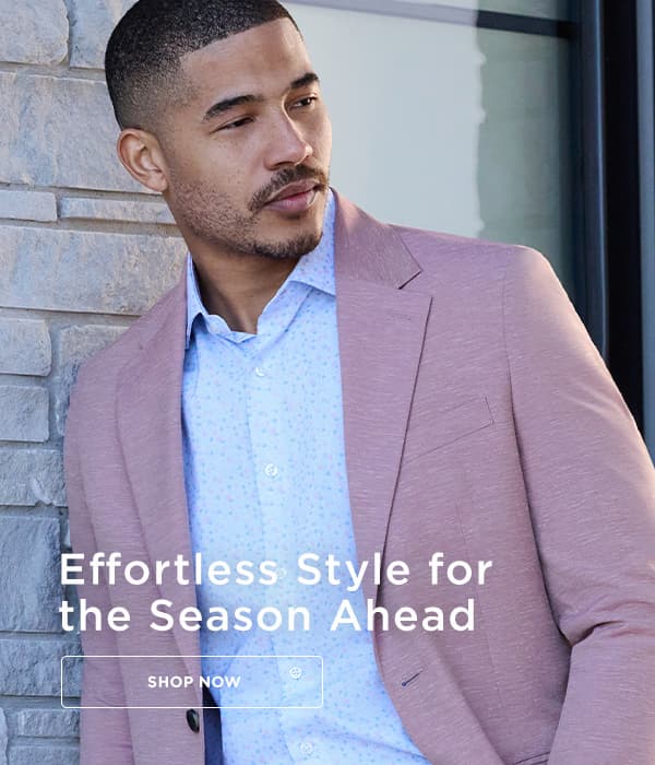 Man poses in a Haggar suit jacket and button up