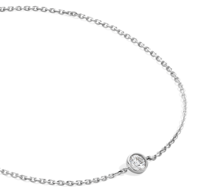 White metal bracelet featuring a bezel set round diamond.