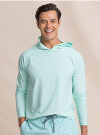 Man in green performance hoodie.