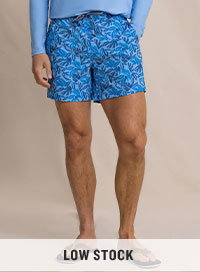 Man in blue patterned swim trunks.