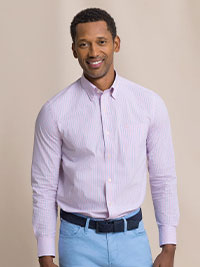 Man in pink and blue stripe sport shirt.