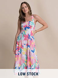 Woman in floral patterned midi dress.