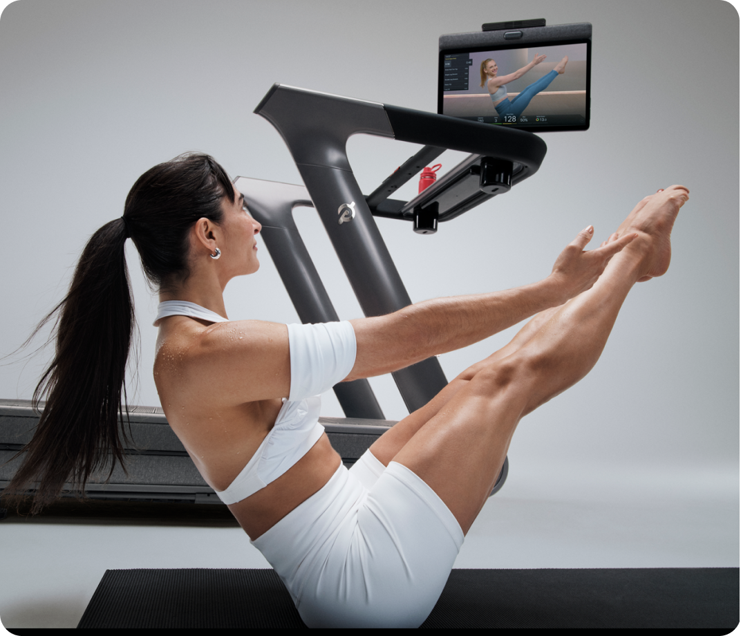Woman ollowing a personalized workout created with Peloton's AI Workout Generator.