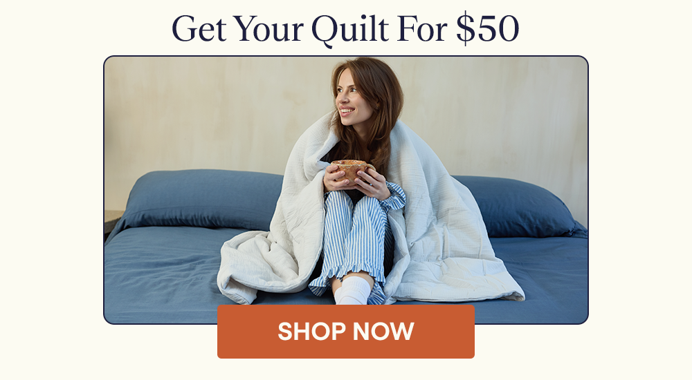 Woman wrapped up in a Cotton Quilt