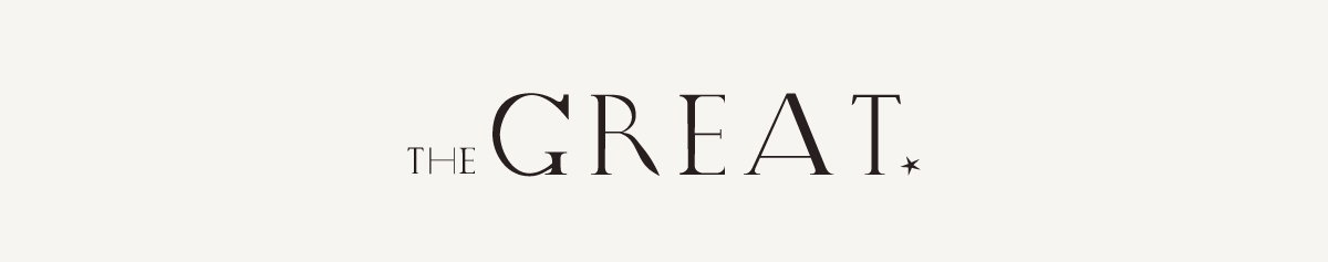 THE GREAT. logo in dark brown serif lettering centered on a soft cream background, with a small star symbol following the brand name.