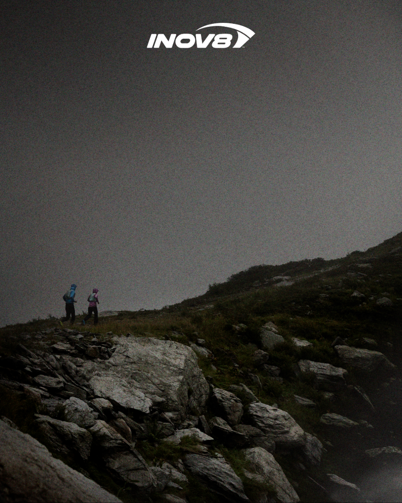 Athletes wearing waterproof jackets running in the rain