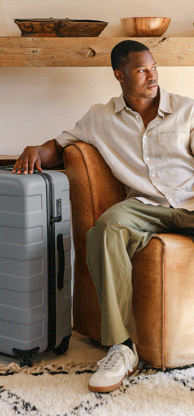 Man and Women Modeling Suitcases