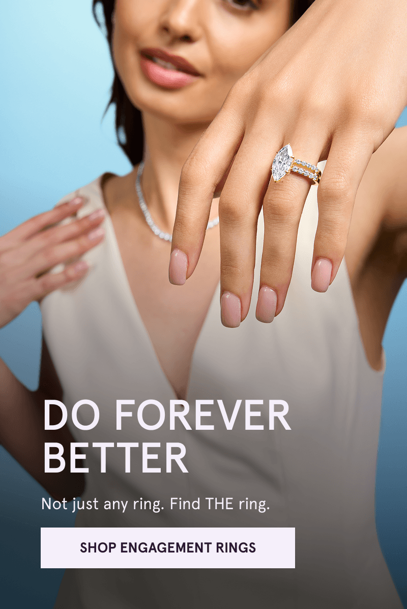Hand wearing marquise-shaped diamond ring. Find THE ring. Click here to shop engagement rings