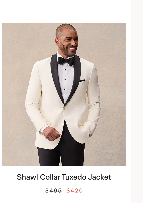 Man wearing an ivory tuxedo jacket with black shawl lapel over a black bow tie and white shirt with black buttons, hands in pockets. Text below the photo: "Contrast Shawl Tuxedo Jacket BUY $371"
