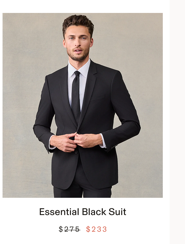Man wearing a black suit with a white shirt and black tie, standing with hands adjusting the jacket button. Text below the photo: "Essential Black Suit BUY $233"