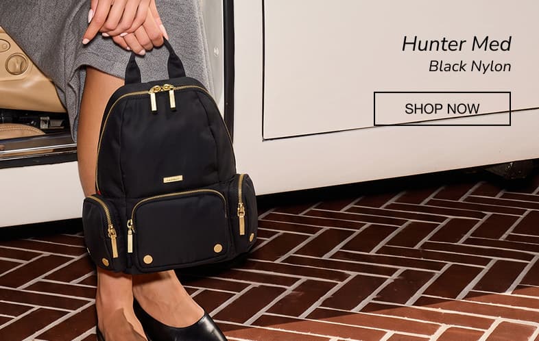 Hammitt Hunter Med backpack in Black Nylon with gold hardware, designed with multiple exterior pockets and a lightweight, travel-ready construction.