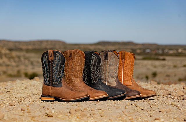 A group of Outlaw Collection Boots in the desert.