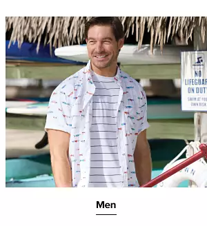 A man in a printed button down and stripe shirt. Men.