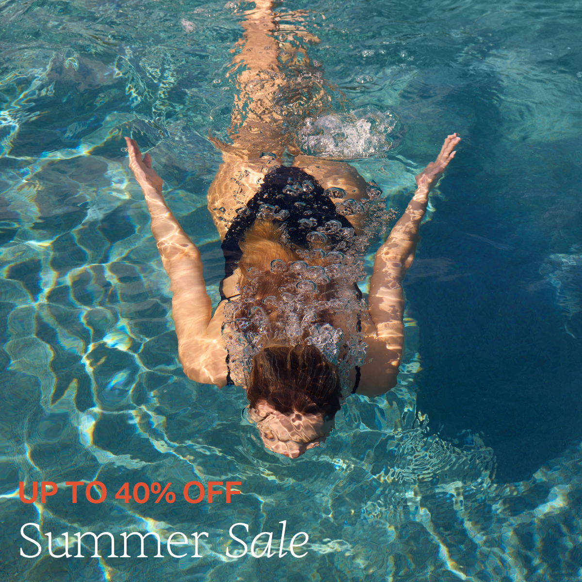 Up to 40% off Summer Sale. Image of women swimming under the water in a pool