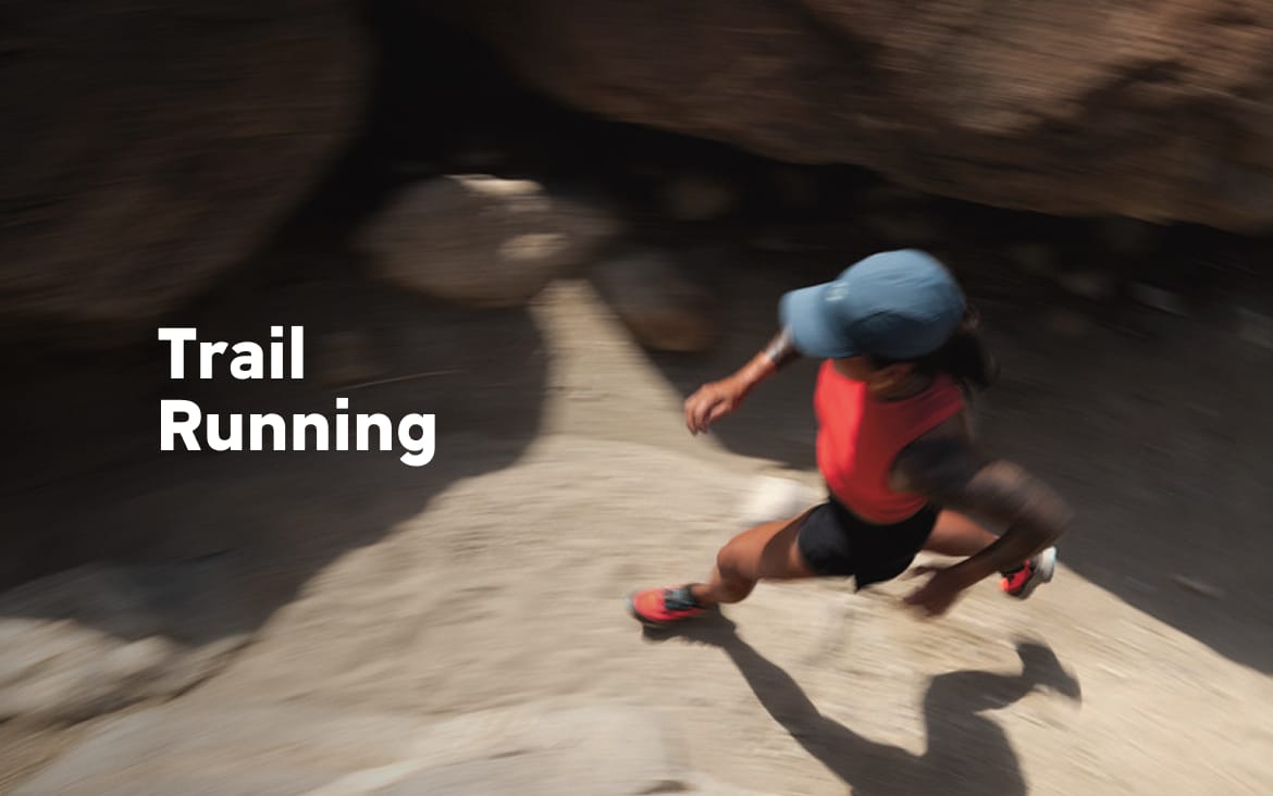 A woman running on a trail with text: Trail Running
