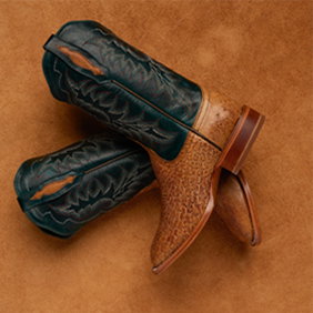 Image of Tony Lama boots on a leather background.