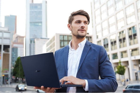 Image of Man with ASUS ExpertBook Laptop