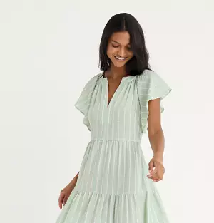 Woman in light green dress. 