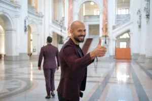 Andrew Tate (left) poses for a photo while entering the Court of Appeal on October 15, 2024 in Bucharest, Romania.