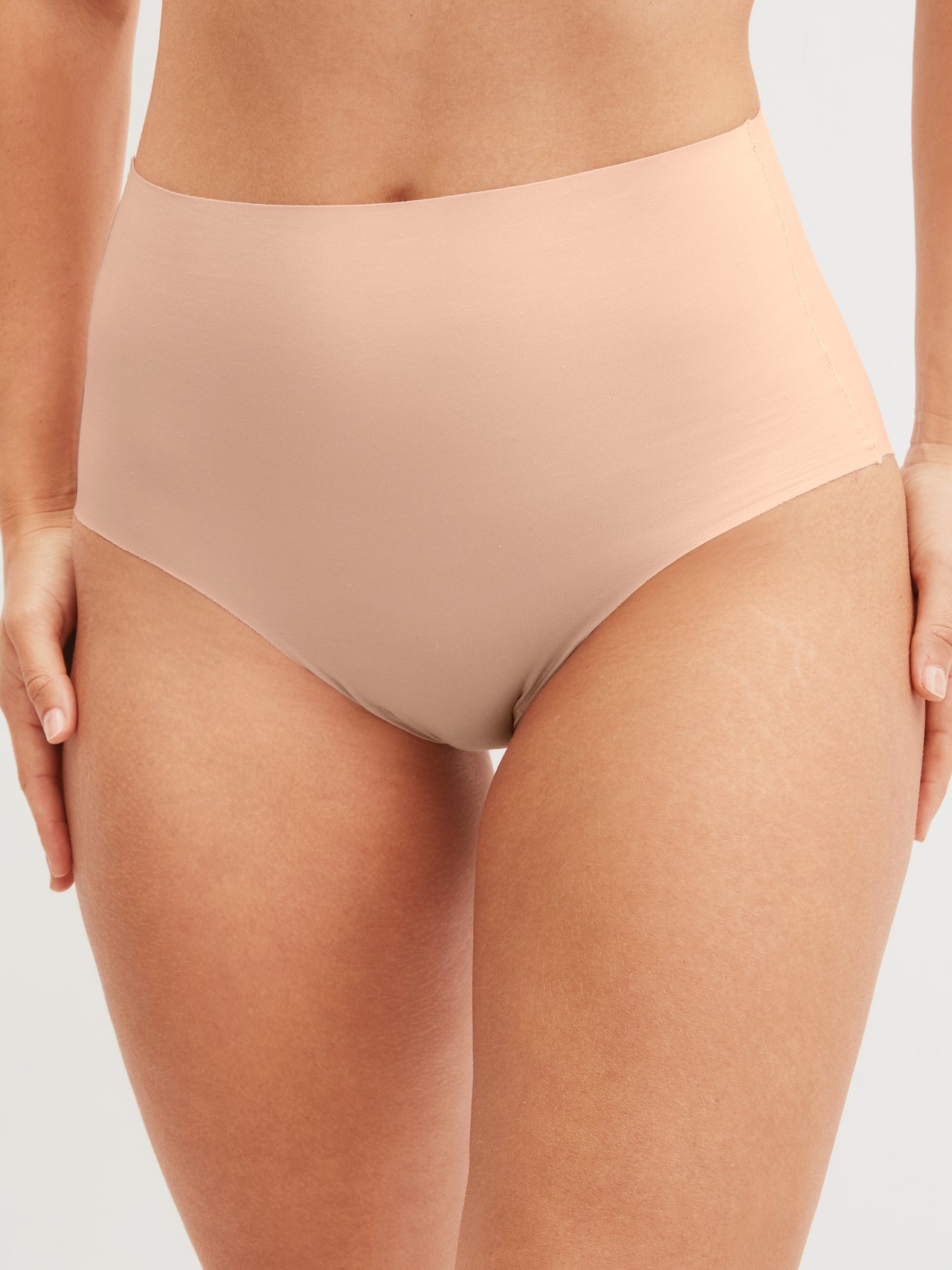 Women model is wearing Seamless High-Waist Brief made of Modal in Pink, Unicoloured from the Natural Skin series by CALIDA, Front view