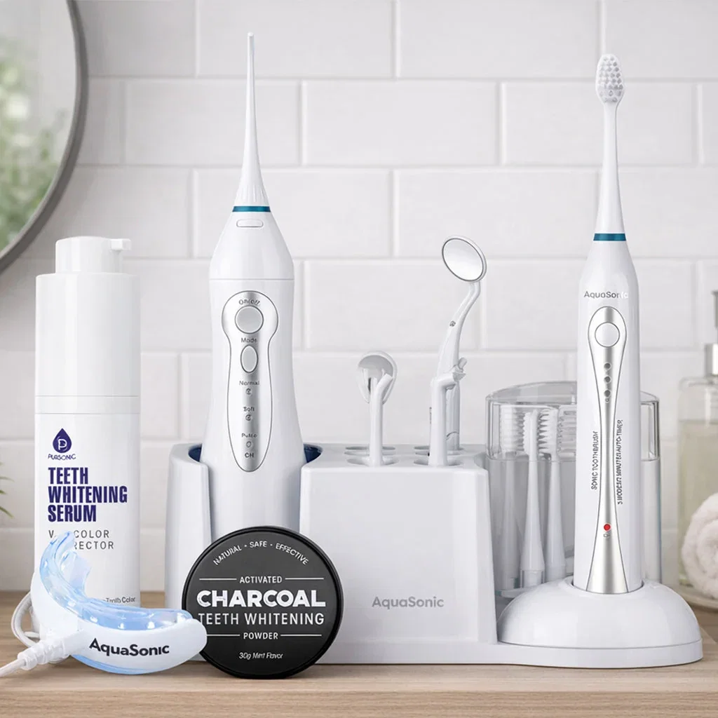 AquaSonic dental care collection featuring electric toothbrushes, whitening serum, charcoal powder, and accessories on bathroom counter.
