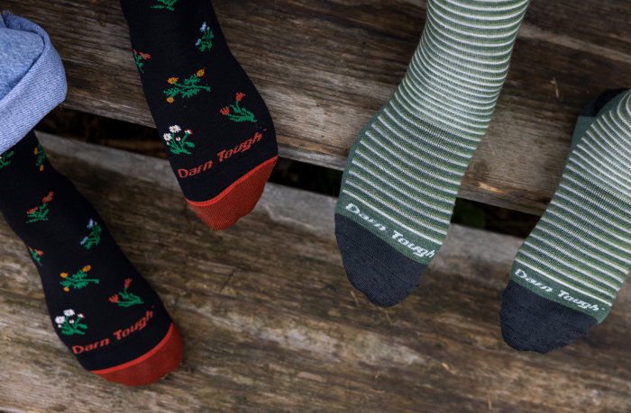 Shop New Lifestyle Socks - feet on weathered wood steps, wearing floral and striped socks