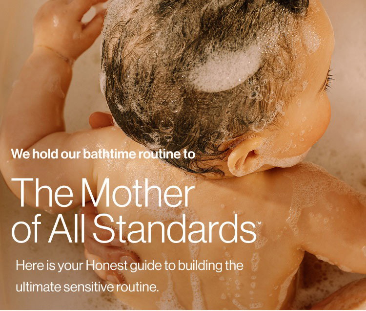 Mom holding baby in bathtub