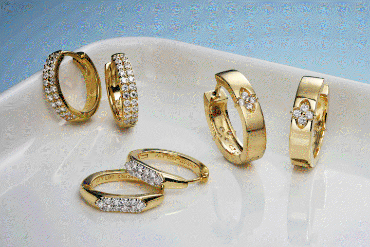 Yellow gold hoops with pavé diamonds and floral accents. Bezel-set diamond pendants. Delicate bracelets. Gemstone rings. 