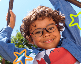 Kid smiling with glasses on
