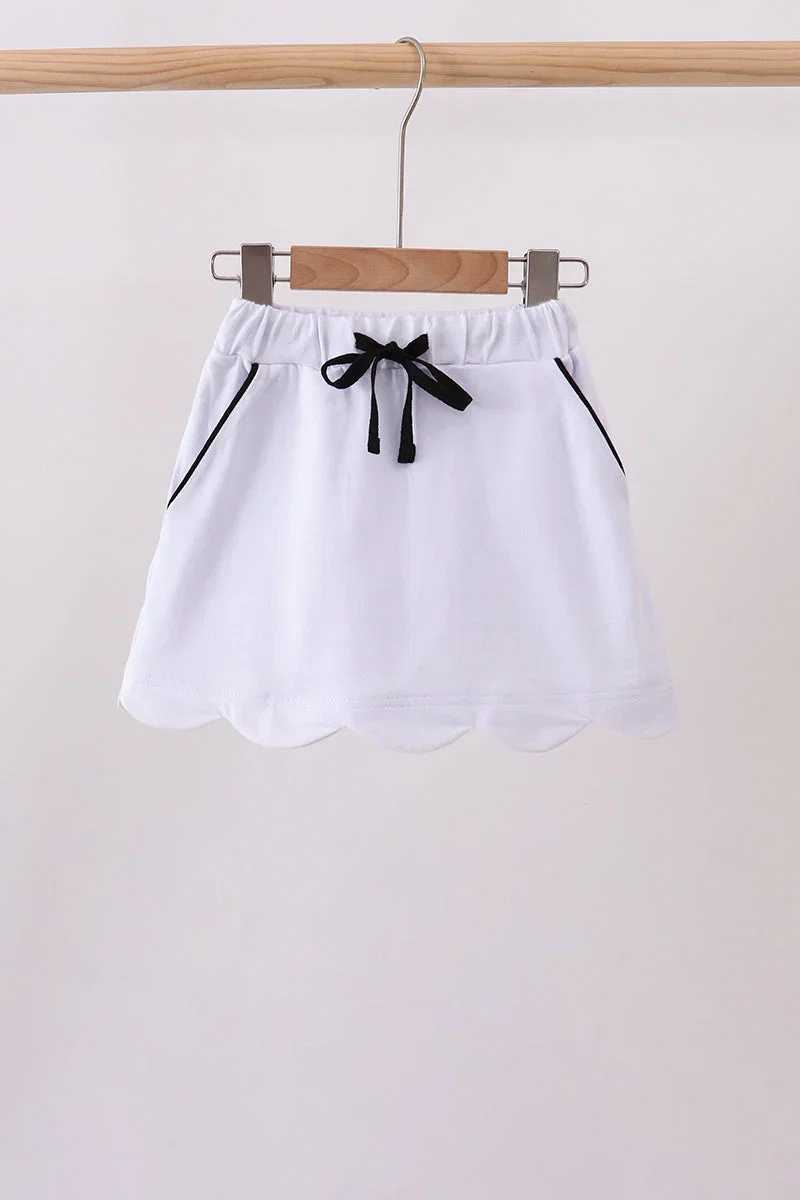 Image of Snow white scallop hem bow skort
