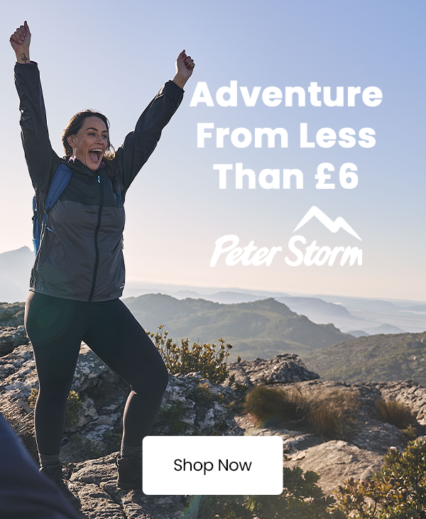 A person stands on a mountain viewpoint in outdoor clothing, promoting affordable Peter Storm adventure essentials from less than £6.