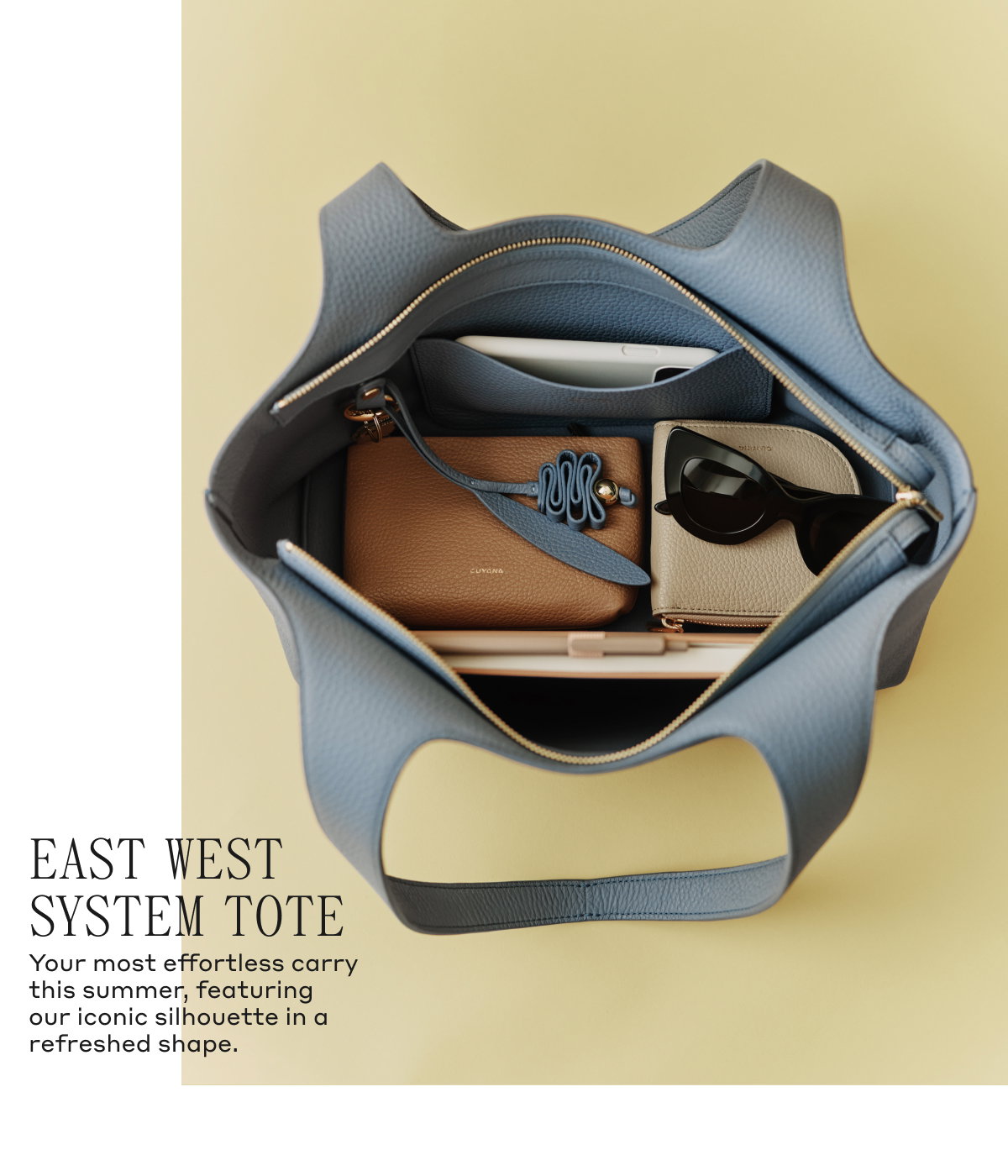 EAST WEST SYSTEM TOTE Your most effortless carry this summer, featuring our iconic silhouette in a refreshed shape.