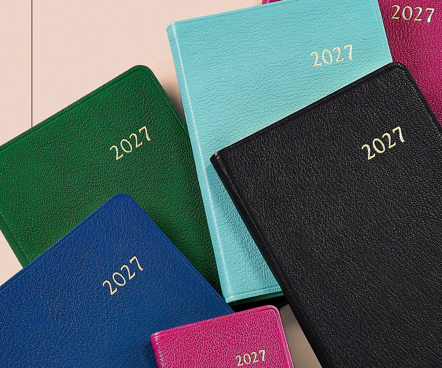 2027 leather datebooks in Azalea, Robin's Egg Blue, Green, Black, and Royal Blue.