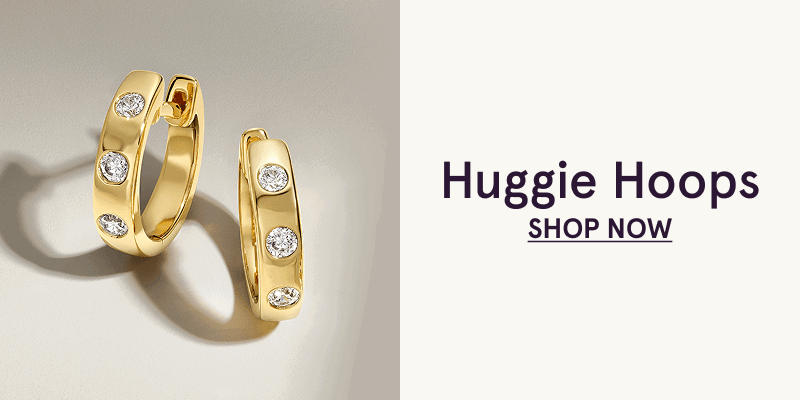 Gold huggie hoops with embedded diamonds. Huggie hoops. Click here to shop now