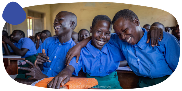 A young group of smiling students.