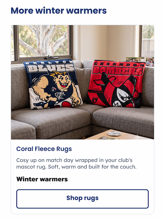 Two pairs of coral fleece rugs sitting on a lounge
