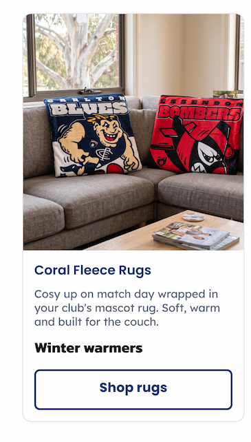 Two pairs of coral fleece rugs sitting on a lounge