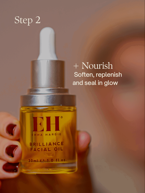 Person holding a bottle of Emma Hardie Brilliance Facial Oil 30ml towards the camera.