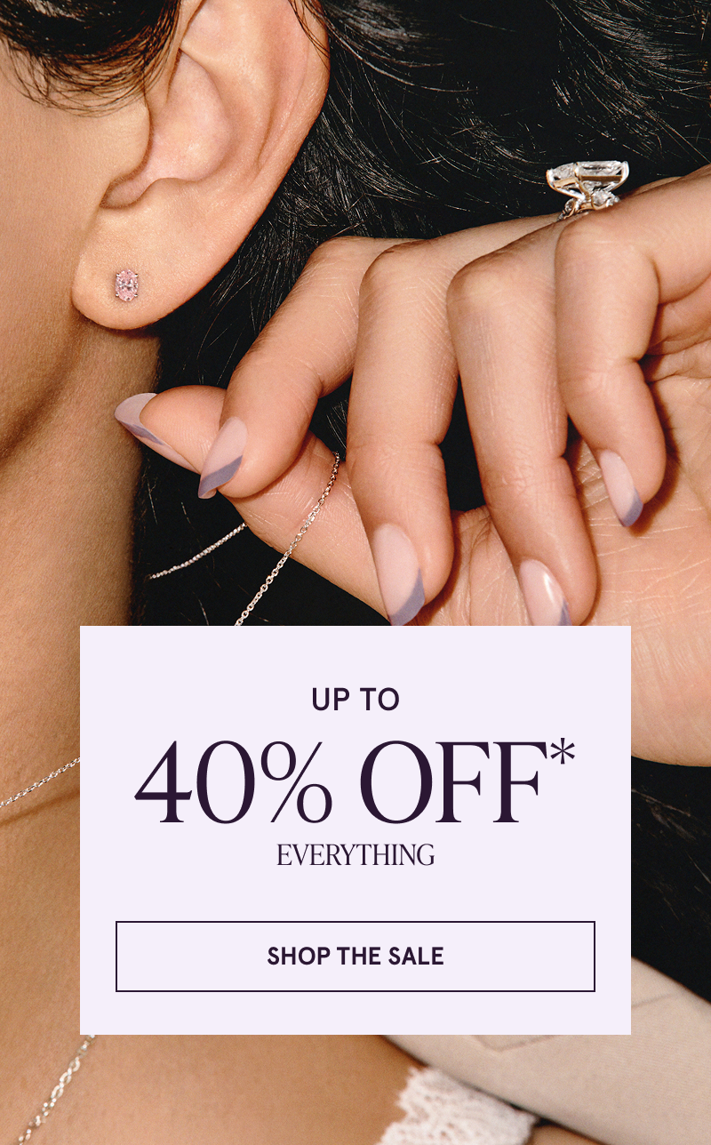 Close up on model’s diamond ring & pink gemstone studs. Up to 40% OFF Everything. Click here to shop the sale