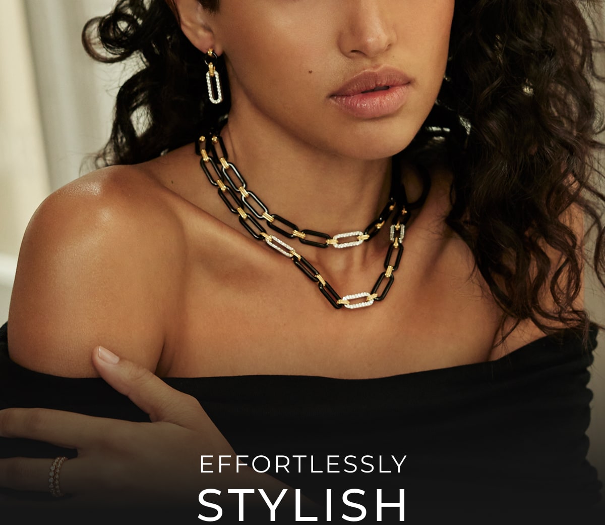 A woman in multiple diamond link necklaces