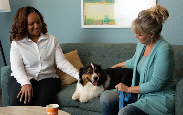 Woman at WoodSpring Suites with her dog