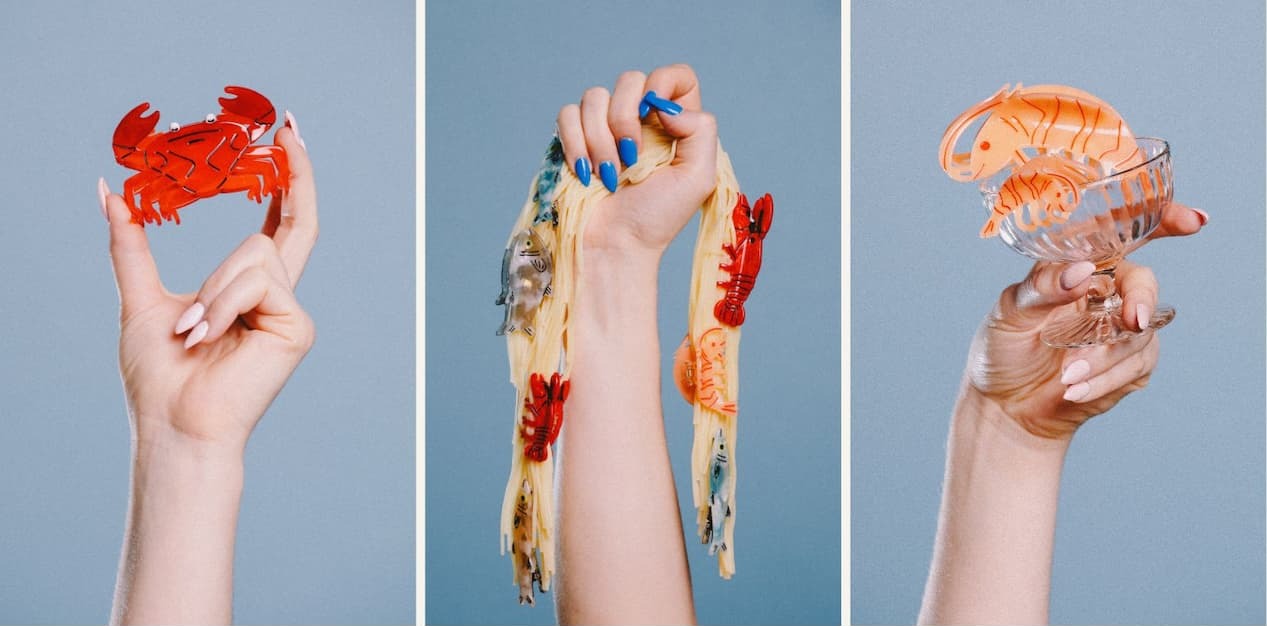 images of a hand holding the new seafood claw clips