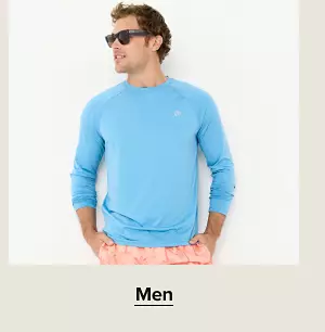 A man in a blue long sleeve shirt. Shop men.
