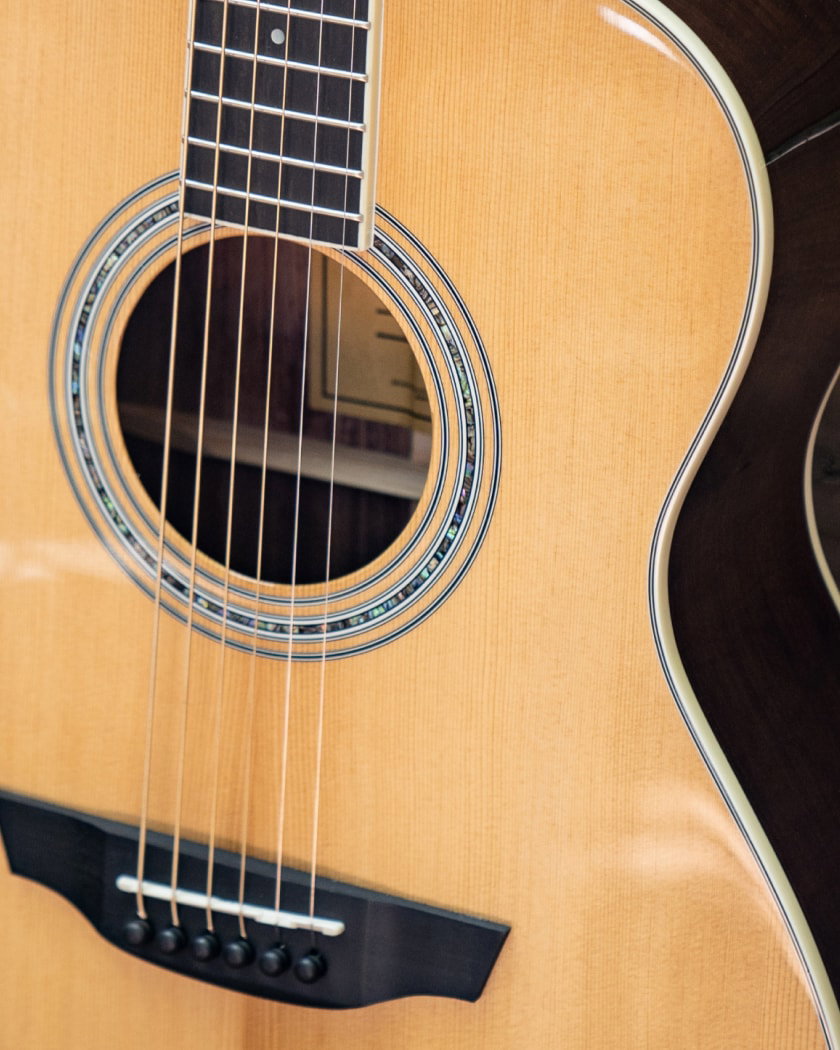 Closeup of sierraa guitar with torrefied spruce wood