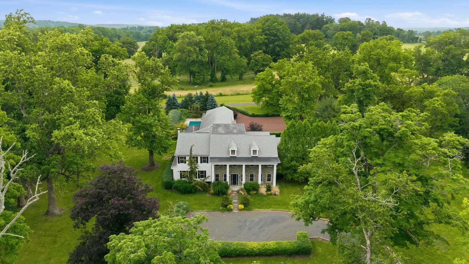 This private sanctuary spans 12 acres and is backed by protected lands