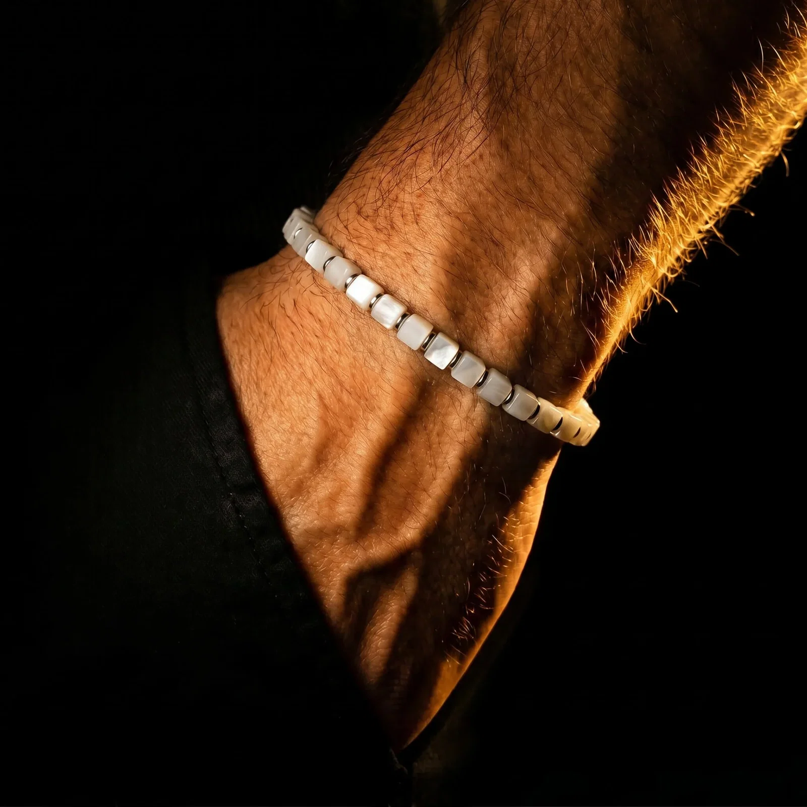 Close view of the Mother of Pearl Cube Bracelet I on the wrist