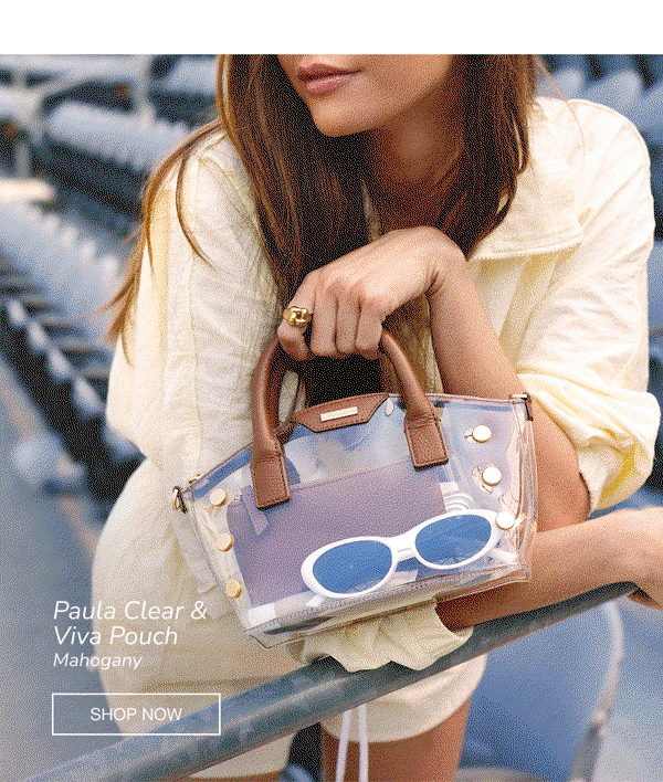 Model carrying the Hammitt Paula Clear bag with a Mahogany Viva Pouch inside, demonstrating how the removable pouch adds privacy, organization, and style to the stadium-approved clear bag.