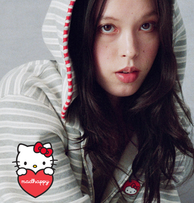 Madhappy x Hello Kitty | Lifestyle image of model in Madhappy Stitched Hoodie with Logo Lockup.
